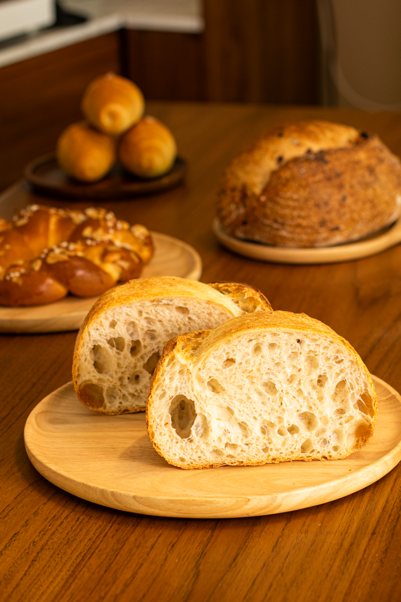 Fresh artisanal sourdough bread with golden crust, baked fresh daily at PK's Oven